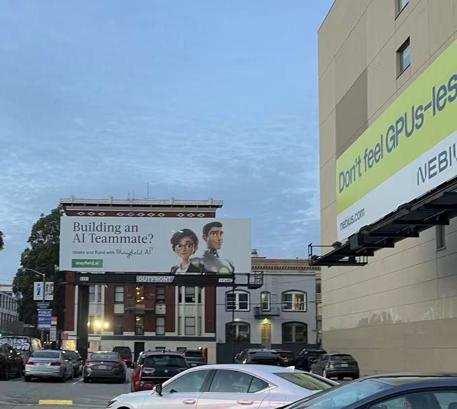 Two different AI billboards on a random San Francisco corner